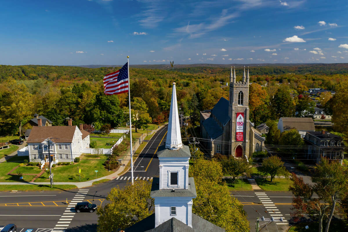 five-business-people-standing-arms-crossed-heads--cropped-out-newtown-ct