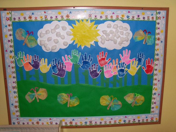 Pre-School-newtown-ct-wall-with-painted-hands-sun-clouds-butterflies