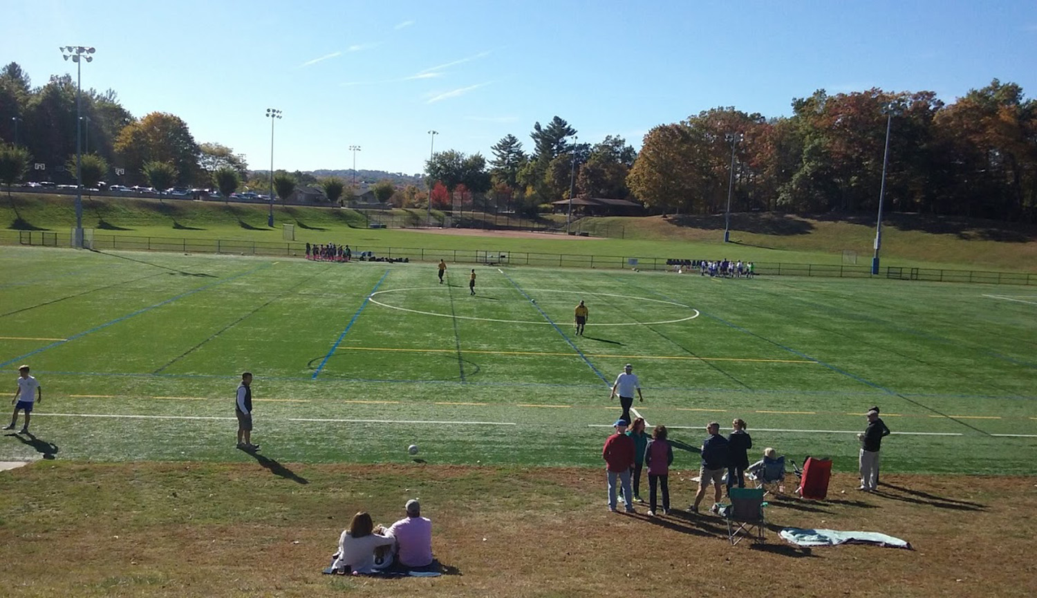 treadwell-park-people-sitting-on-sidelines-at-football-game-newtown-ct