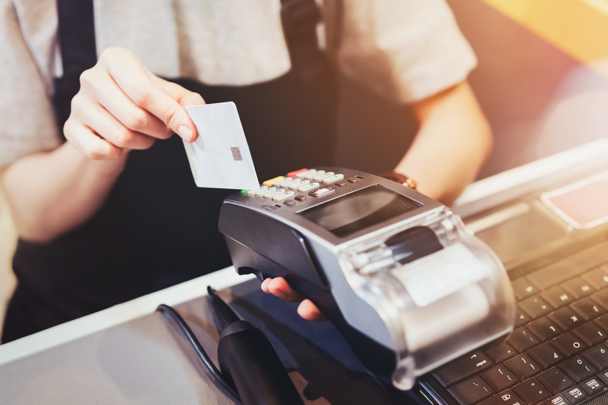 Close-up-of-hand-use-credit-card-swiping-machine-to-pay-newtown-ct