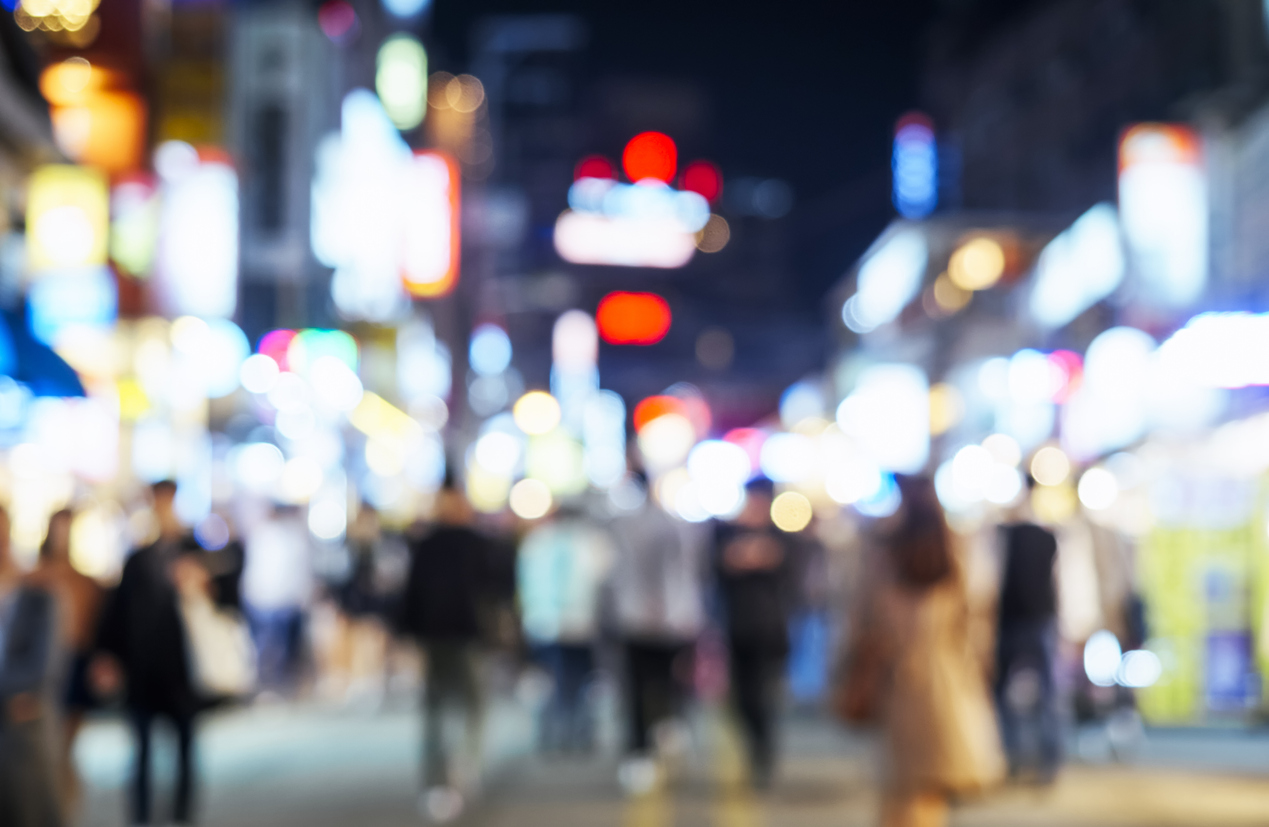 Blurred-People-walking-on-Shopping-Street-Outdoor-City-Nightlife-newtown-ct